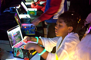 Young girl operating lunchbox laser